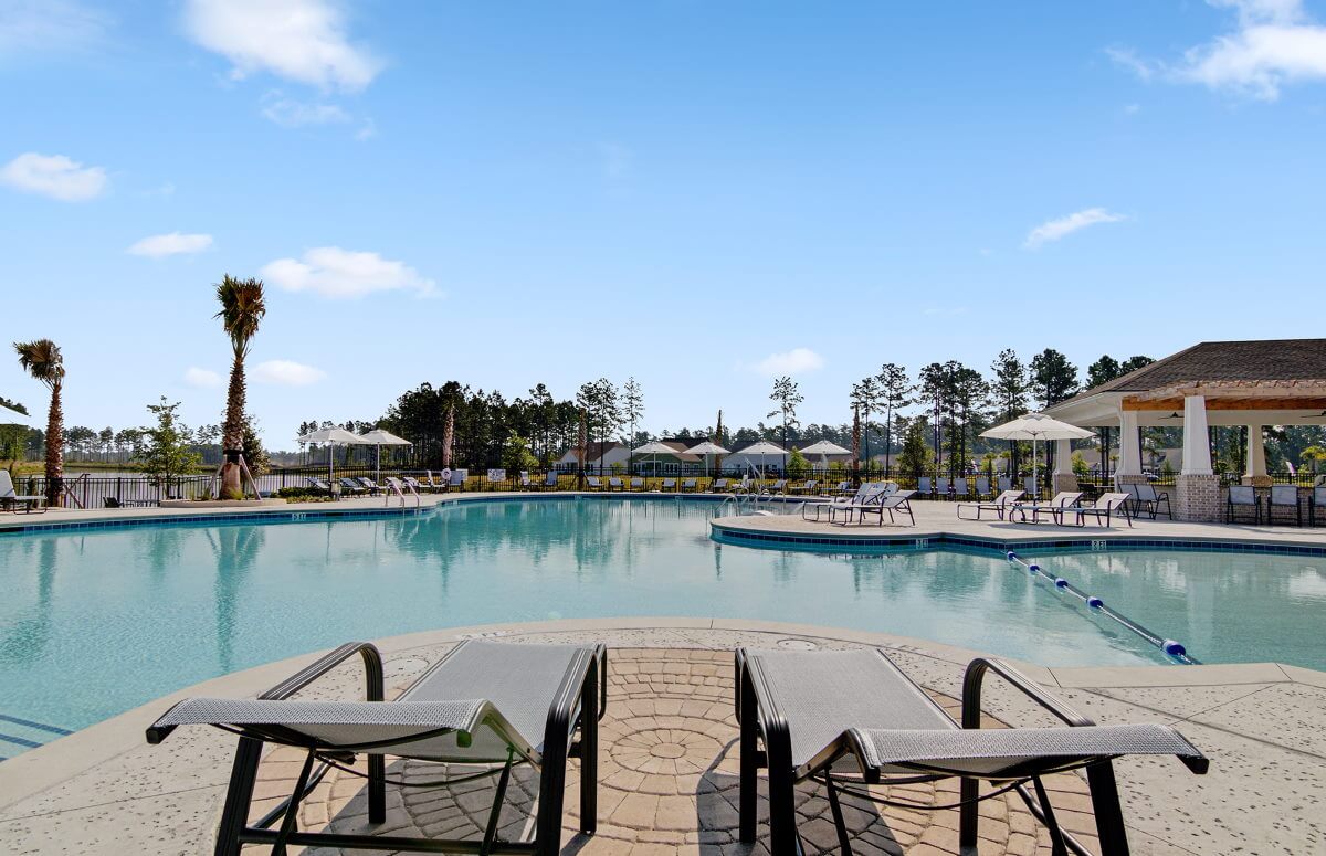 Four Seasons at Lakes of Cane Bay Outdoor Pool with Lounge Chairs